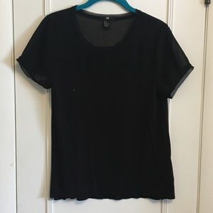 Black top with transparent upper collar/shoulder